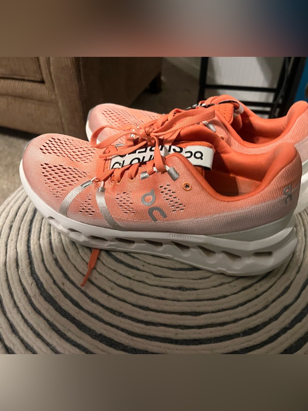 On Running Coral-Orange Women's Sneakers with Silver Accents
